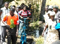 volunteering in Zambia when retired, Peddling farmer pumps water 